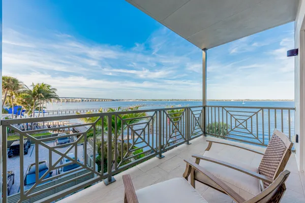 a spacious bedroom with a large bed and a large window