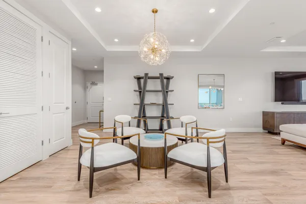 a spacious bedroom with a bed and a table