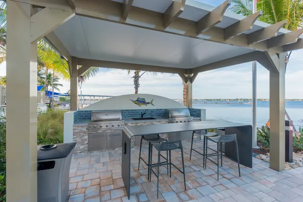a view of a swimming pool with a table and chairs