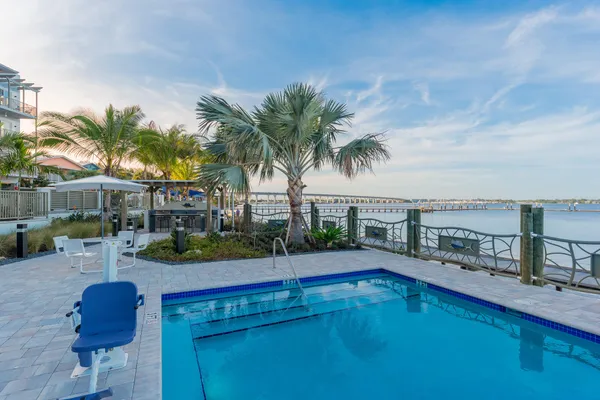a kitchen with stainless steel appliances a sink a stove and a refrigerator