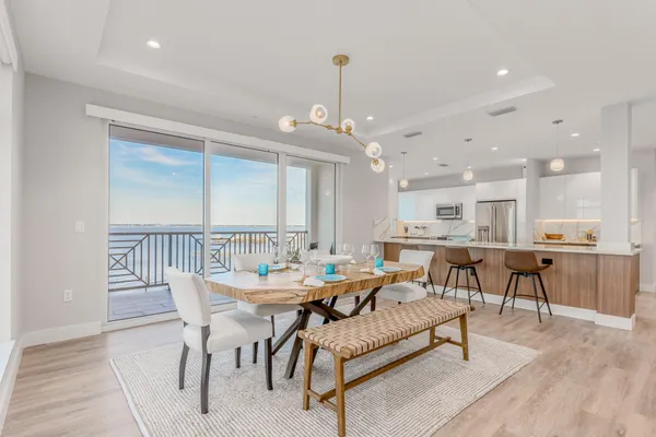 a very nice looking dining room with a table and chairs