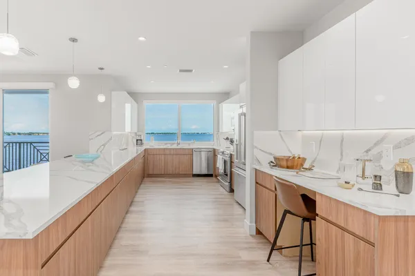 a large kitchen with a lot of counter space and a sink