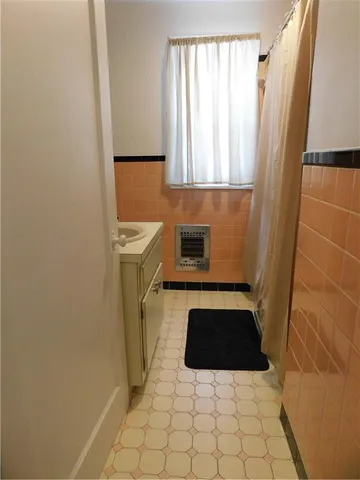 a kitchen with a refrigerator a stove a washer and dryer