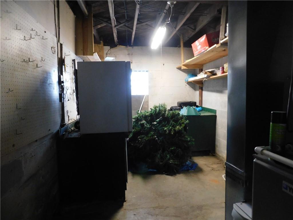 1687 Rte 481 Charleroi, PA 15022 - Photo 29 of 30 a room with water heater and wooden walls