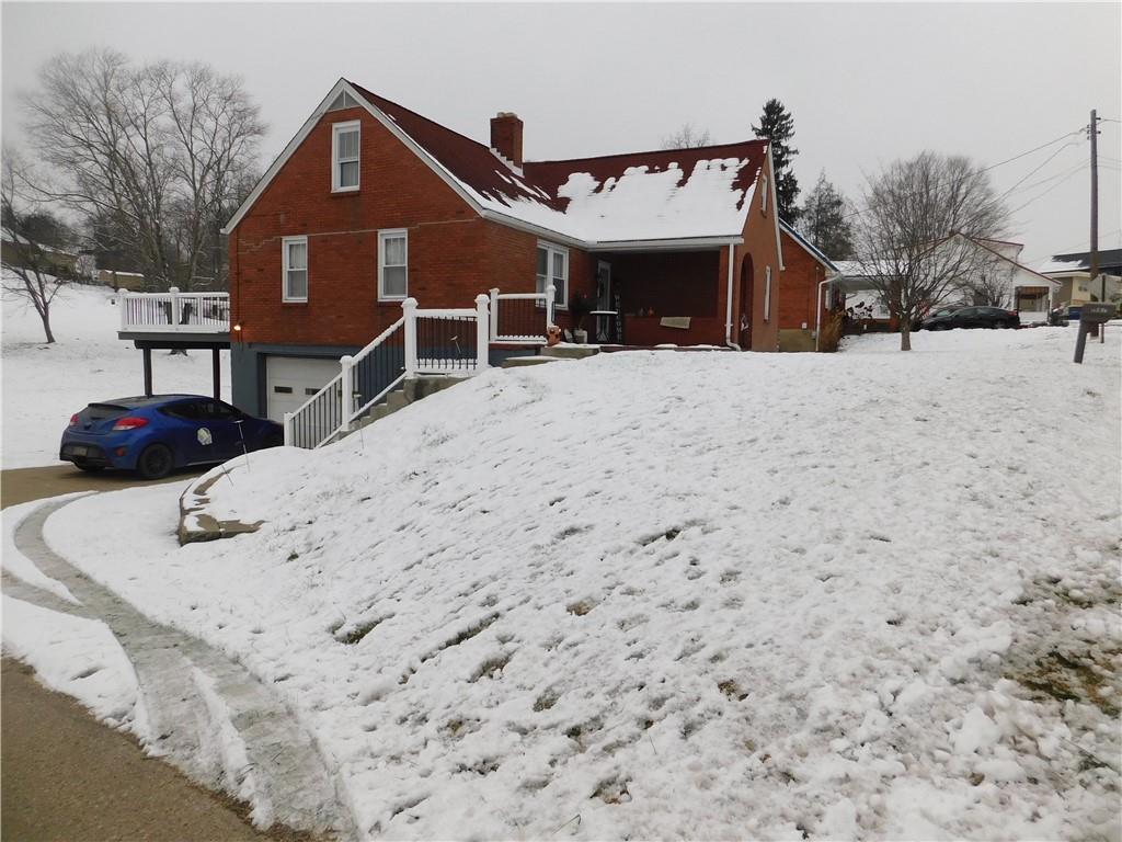 1687 Rte 481 Charleroi, PA 15022 - Photo 3 of 30 a view of a house with a yard covered in snow