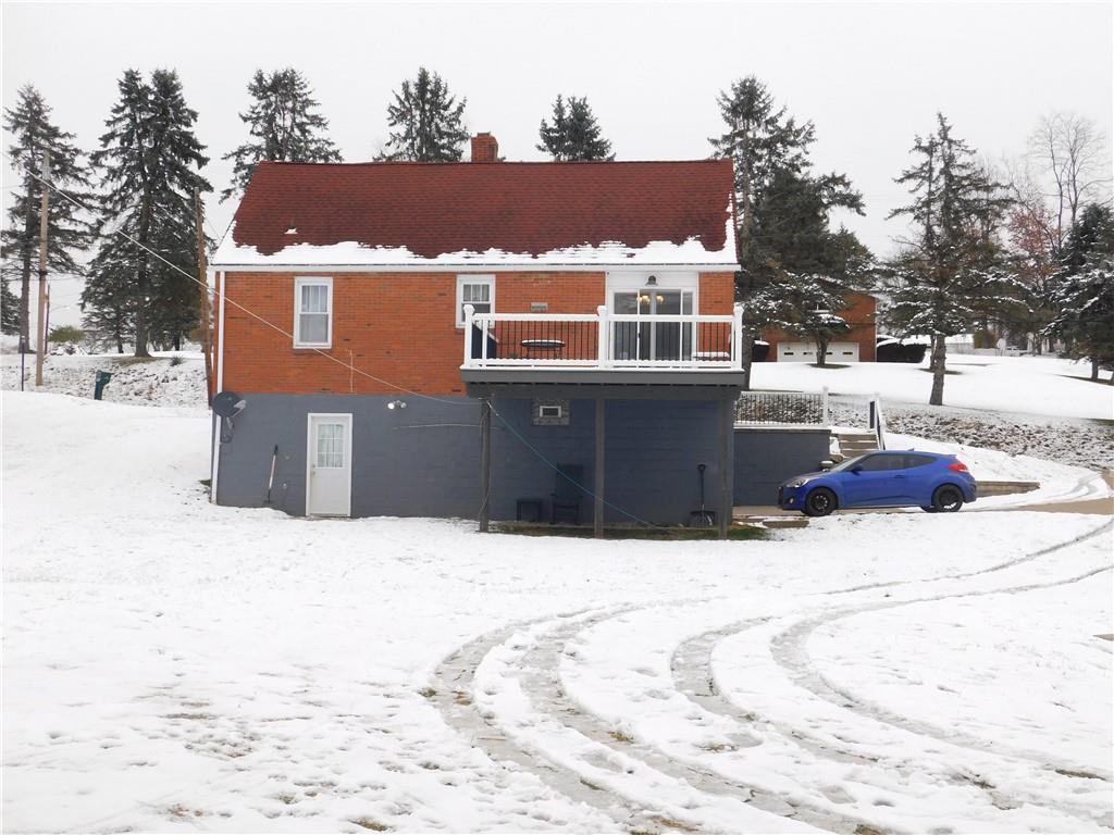 1687 Rte 481 Charleroi, PA 15022 - Photo 6 of 30 a front view of house with yard covered with trees