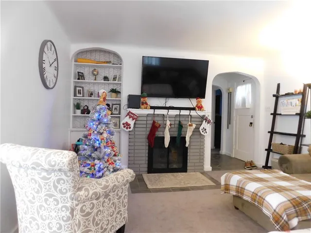 a bed room with a bed and a flat screen tv