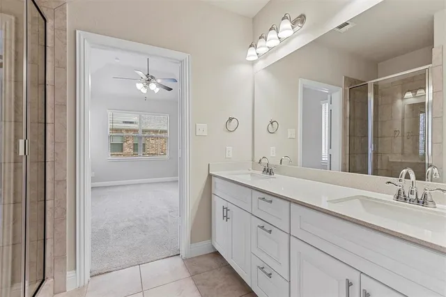 a bathroom with a double vanity sink and a mirror