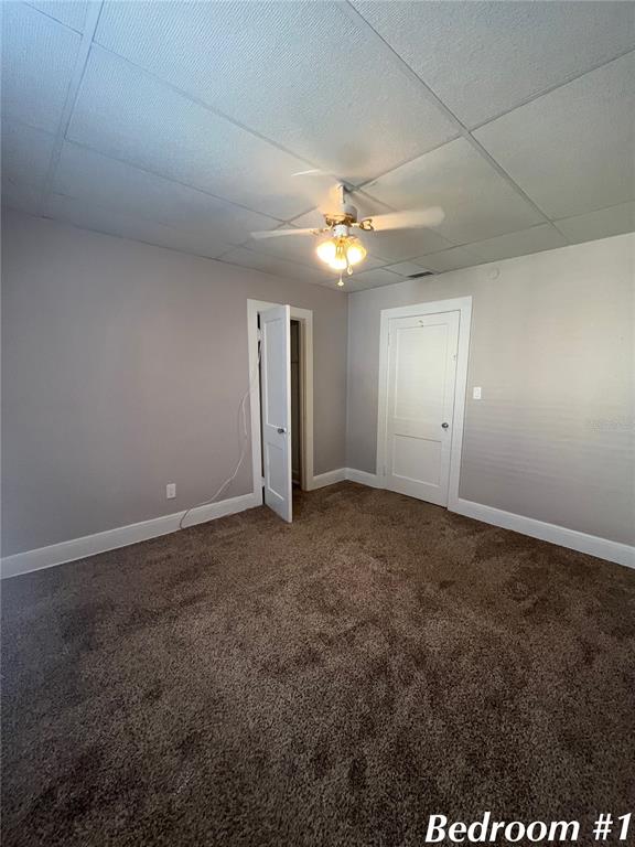 3303 West Empedrado Street, Unit 1 Tampa, FL 33629 - Photo 11 of 16 a view of an empty room with a ceiling fan