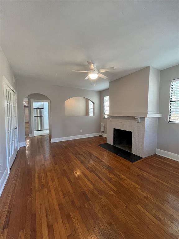 3303 West Empedrado Street, Unit 1 Tampa, FL 33629 - Photo 2 of 16 a view of empty room with wooden floor and fireplace