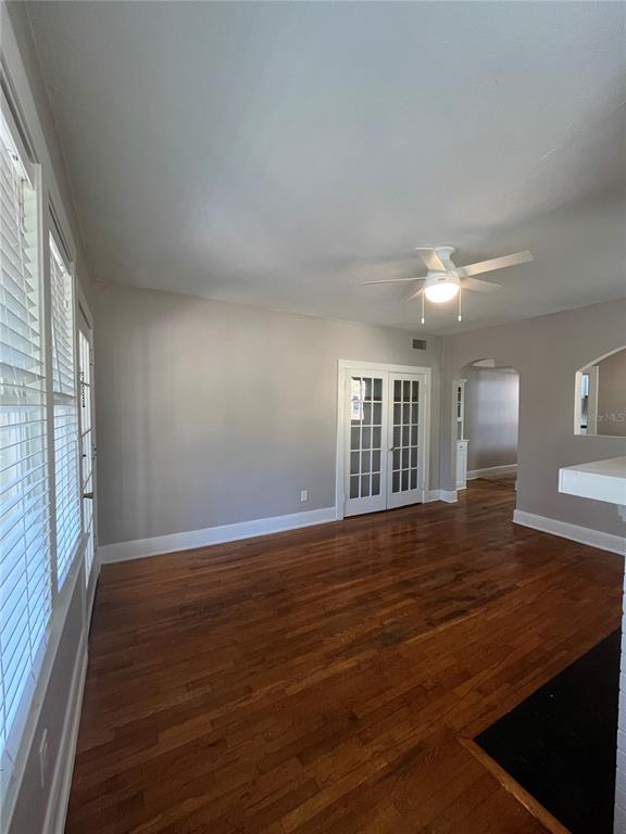 3303 West Empedrado Street, Unit 1 Tampa, FL 33629 - Photo 3 of 16 a view of an empty room with wooden floor and a window