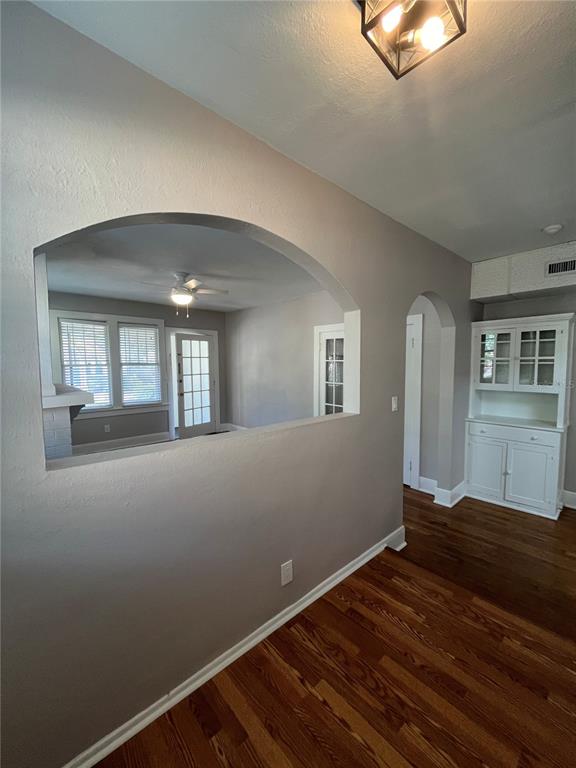 3303 West Empedrado Street, Unit 1 Tampa, FL 33629 - Photo 6 of 16 a view of empty room with wooden floor and fan