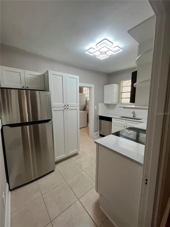 3303 West Empedrado Street, Unit 1 Tampa, FL 33629 - Photo 8 of 16 a kitchen with stainless steel appliances granite countertop a refrigerator a sink and a stove