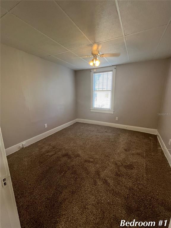 3303 West Empedrado Street, Unit 1 Tampa, FL 33629 - Photo 10 of 16 an empty room with a empty space and windows