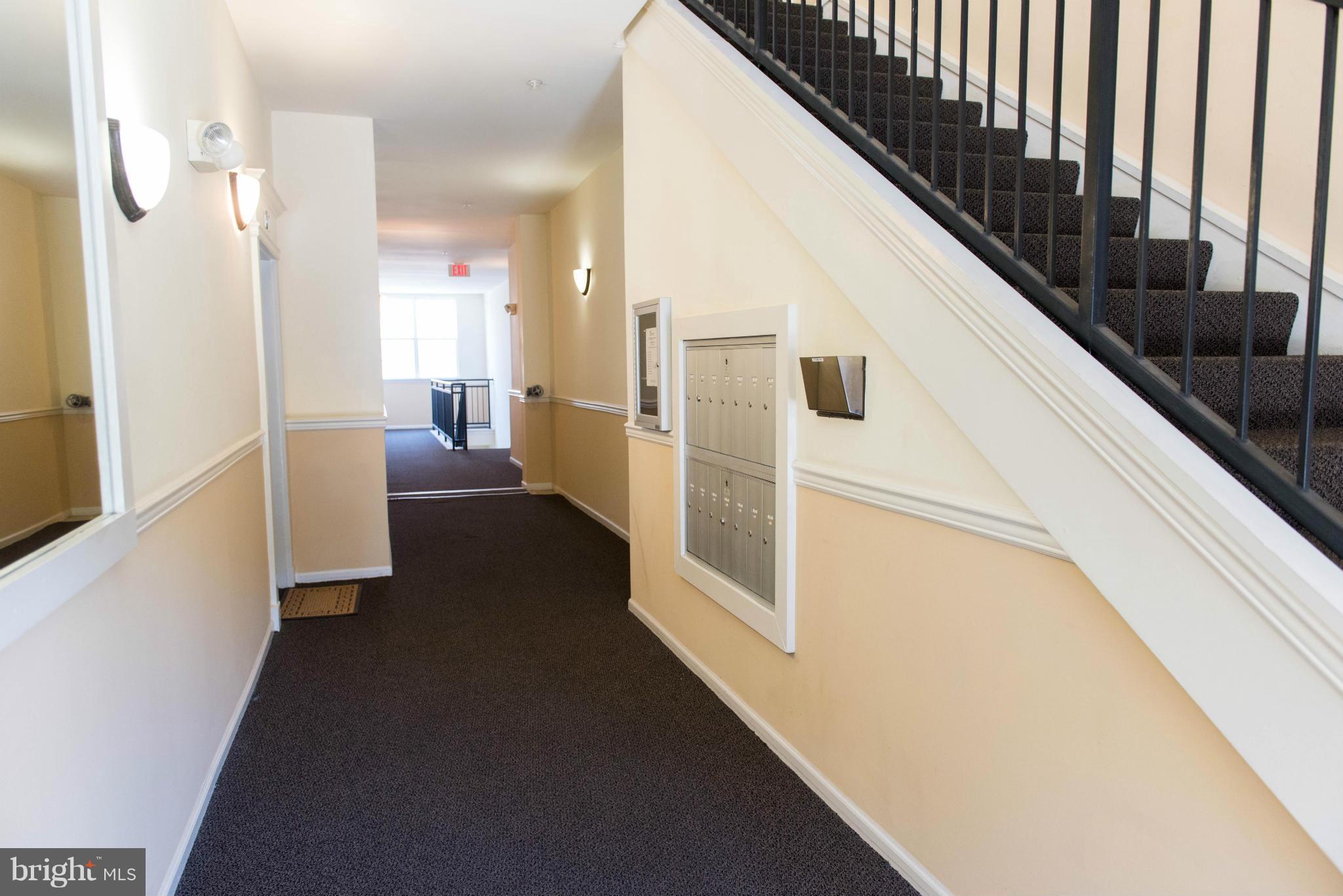1516 North Point Drive, Unit 104 Reston, VA 20194 - Photo 2 of 25 Main Floor Hallway with Mailboxes