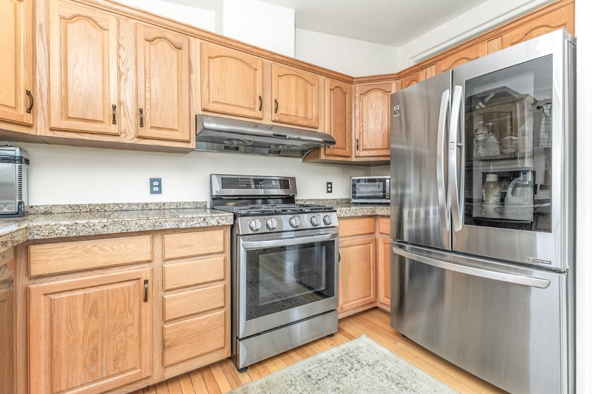 26870 Beaver Canyon Drive Clark, CO 80428 - Photo 14 of 50 a kitchen with stainless steel appliances granite countertop a refrigerator and cabinets
