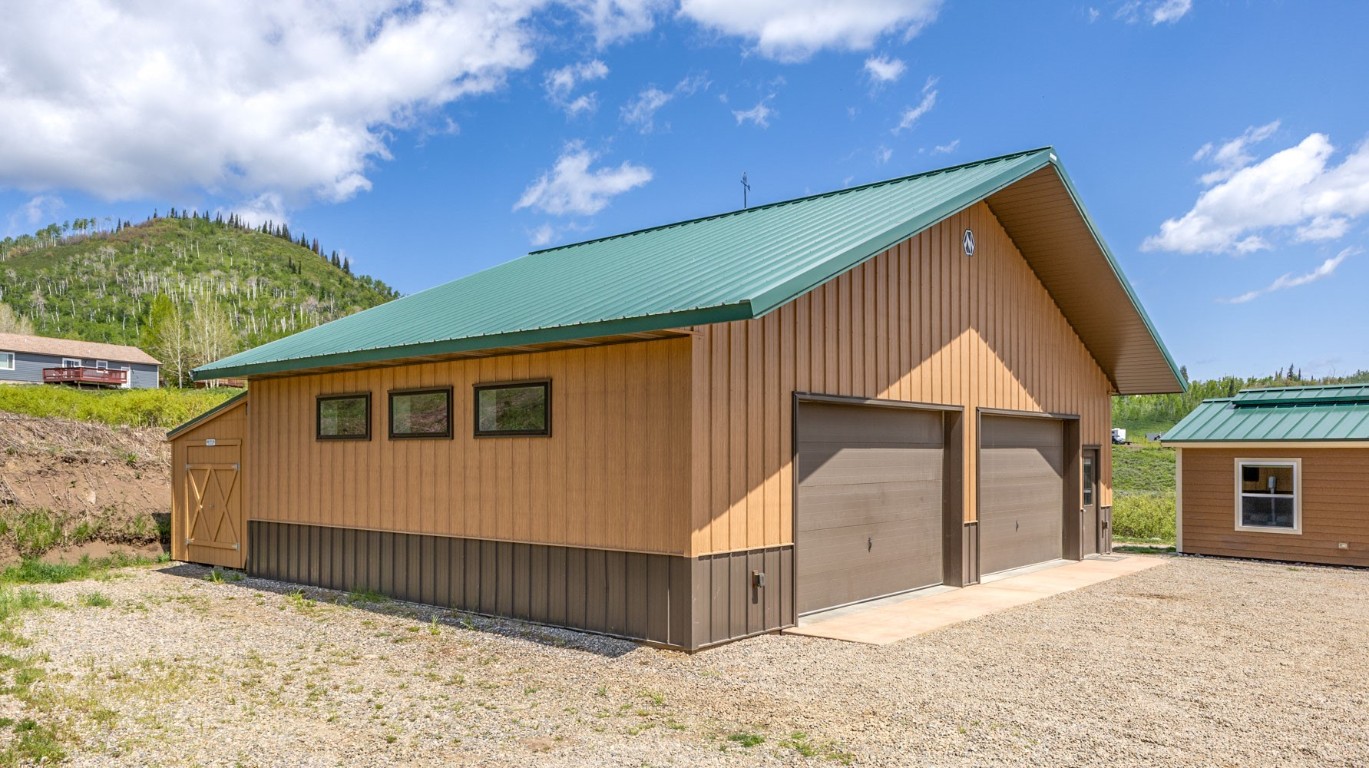 26870 Beaver Canyon Drive Clark, CO 80428 - Photo 3 of 50 a front view of a house with a yard