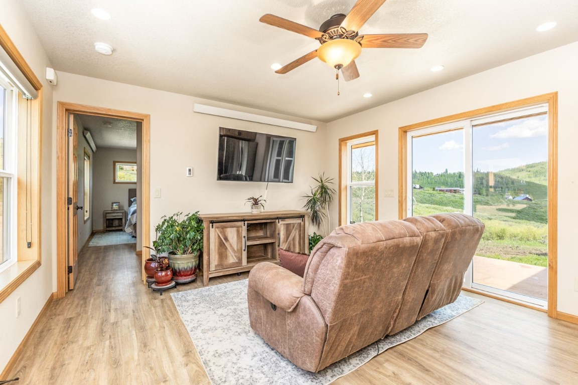 26870 Beaver Canyon Drive Clark, CO 80428 - Photo 31 of 50 a living room with furniture and a flat screen tv