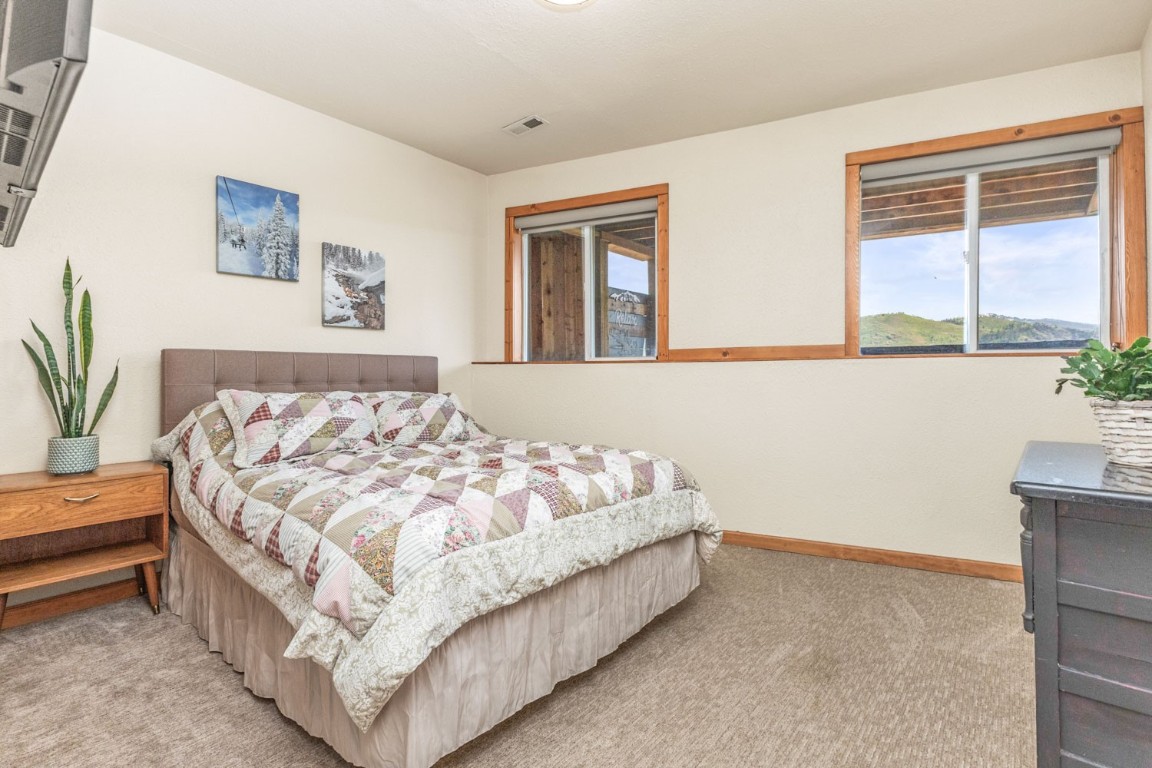 26870 Beaver Canyon Drive Clark, CO 80428 - Photo 36 of 50 a bed sitting in a bedroom next to a window