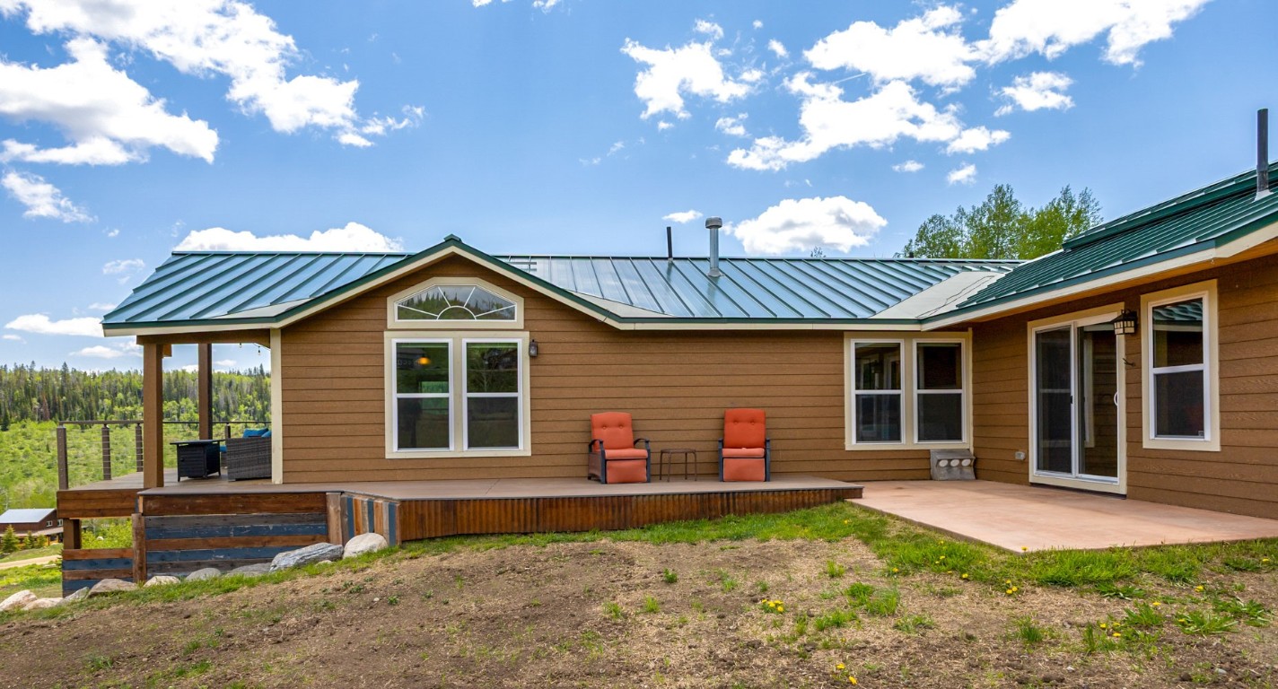 26870 Beaver Canyon Drive Clark, CO 80428 - Photo 44 of 50 a front view of a house with garden