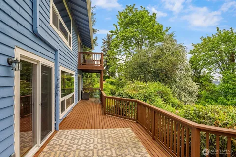 a view of a balcony with wooden floor