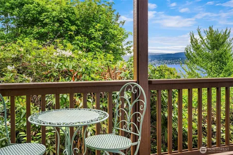 a view of a chair and table in the balcony