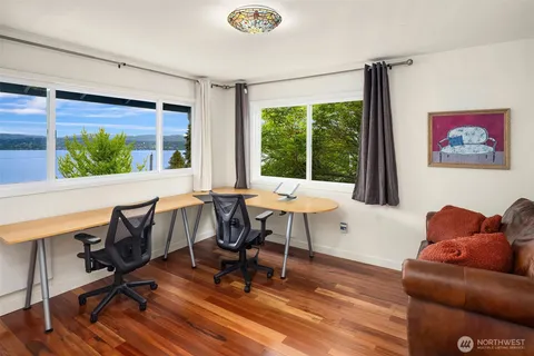 a workspace with furniture and a window