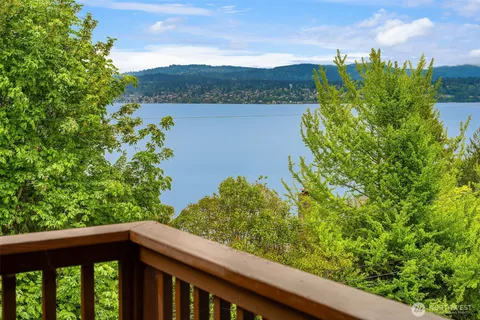a view of a forest from a balcony