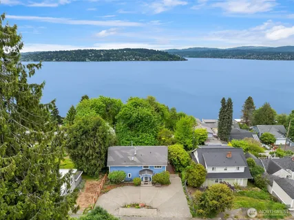 an aerial view of a house with a lake view