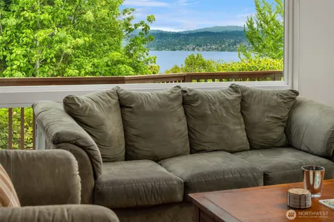 a living room with furniture and a garden