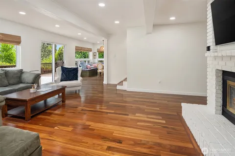 a living room with fireplace furniture and a flat screen tv