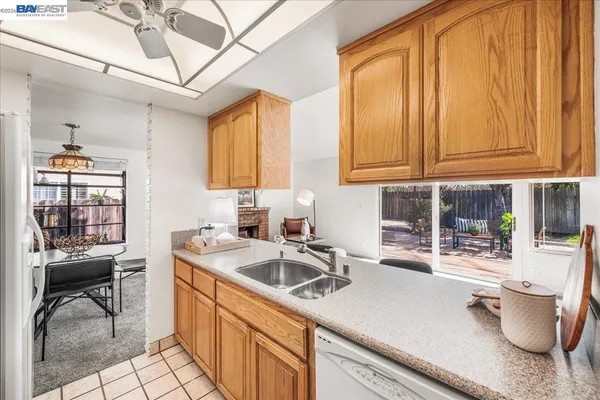 a kitchen with granite countertop cabinets and steel stainless steel appliances