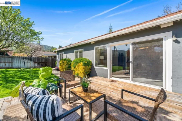 a front view of house with yard and outdoor seating