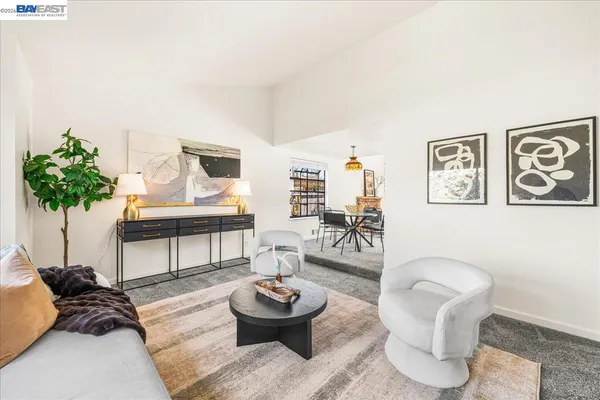 a living room with furniture and a table