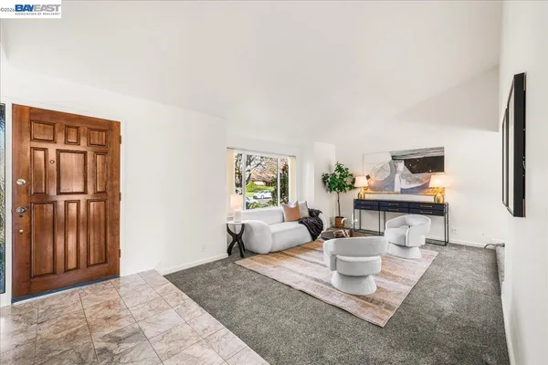 a view of a dining room with furniture window and outside view