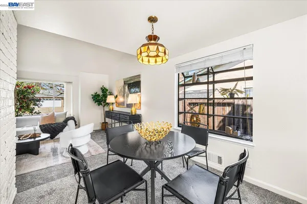 a kitchen with stainless steel appliances granite countertop a sink a stove a microwave and cabinets