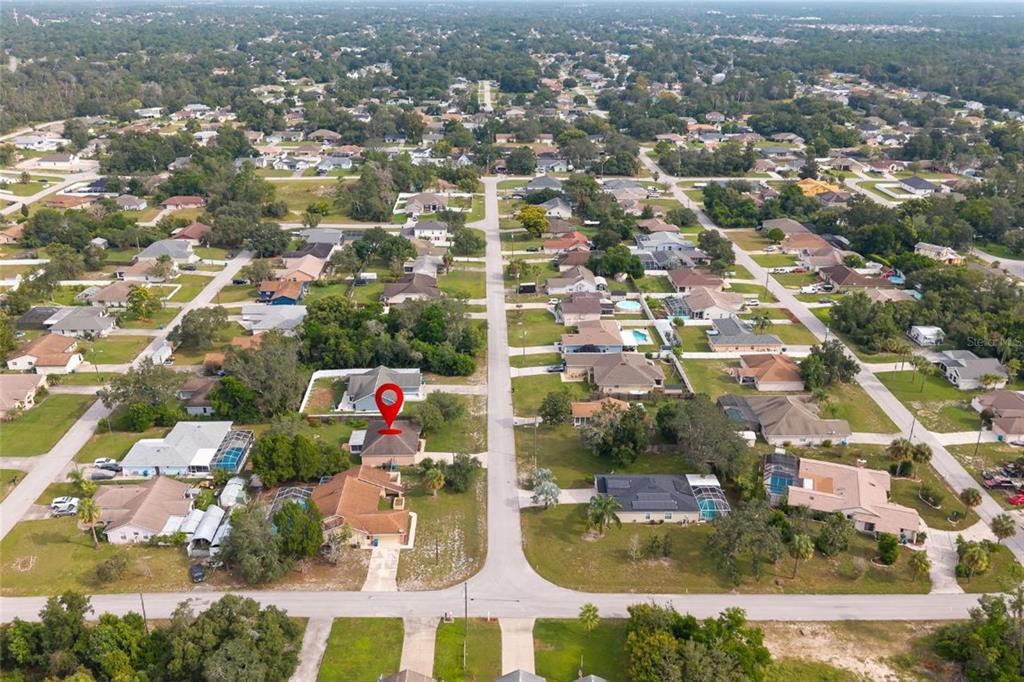 1009 Stratton Avenue Spring Hill, FL 34609 - Photo 27 of 29 an aerial view of residential houses with outdoor space and swimming pool