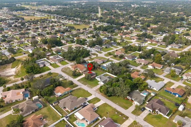 an aerial view of residential houses with city view