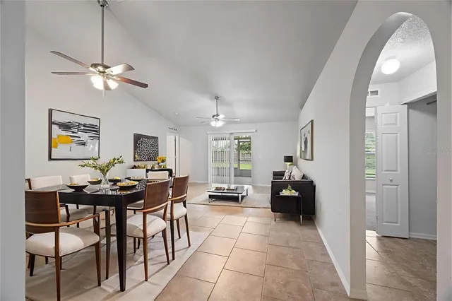 a view of a livingroom with furniture and a ceiling fan