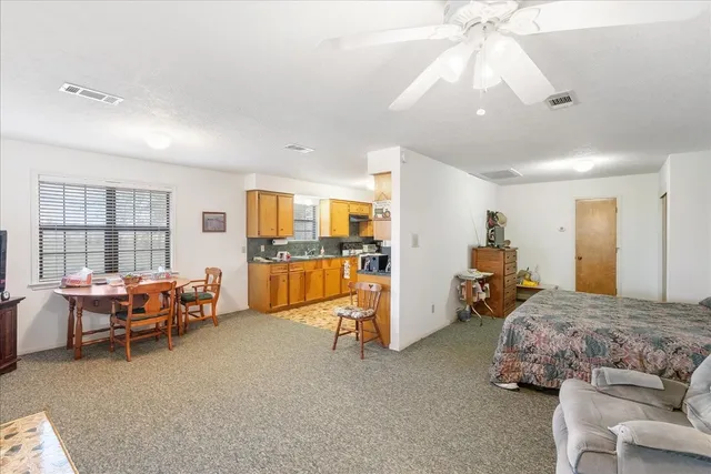 a bedroom with furniture and a chandelier