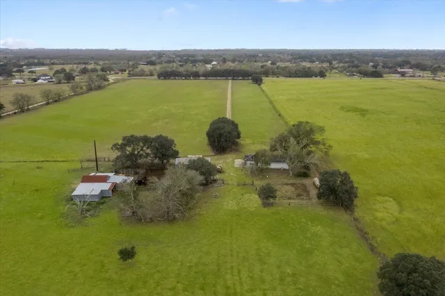 a wooden bench sitting in the middle of a lake