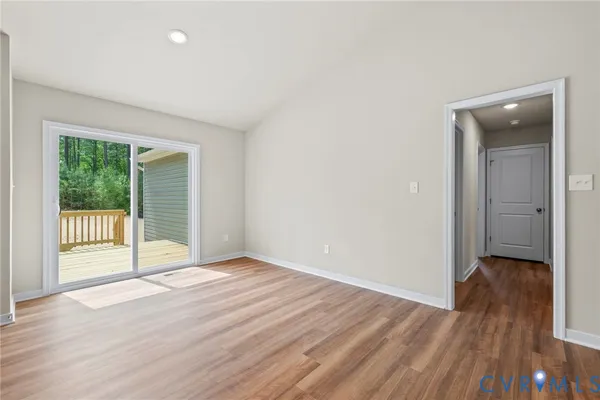 a view of a kitchen cabinets a sink and wooden floor