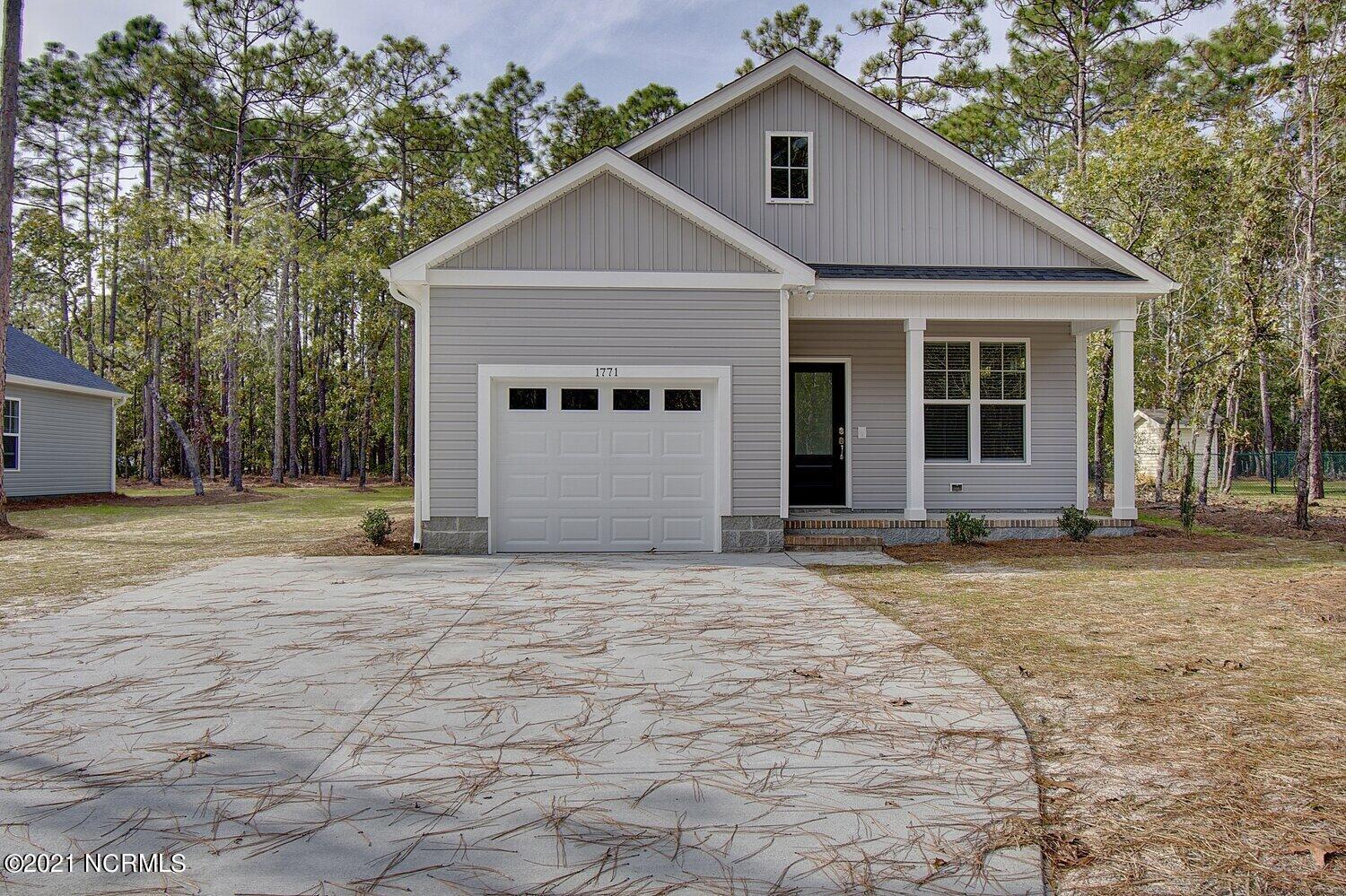 245 Sycamore Road Southport, NC 28461 - Photo 1 of 38 Previously Built Home Picture is a representation of what is to be built. Colors and finishes will vary and are subject to change.