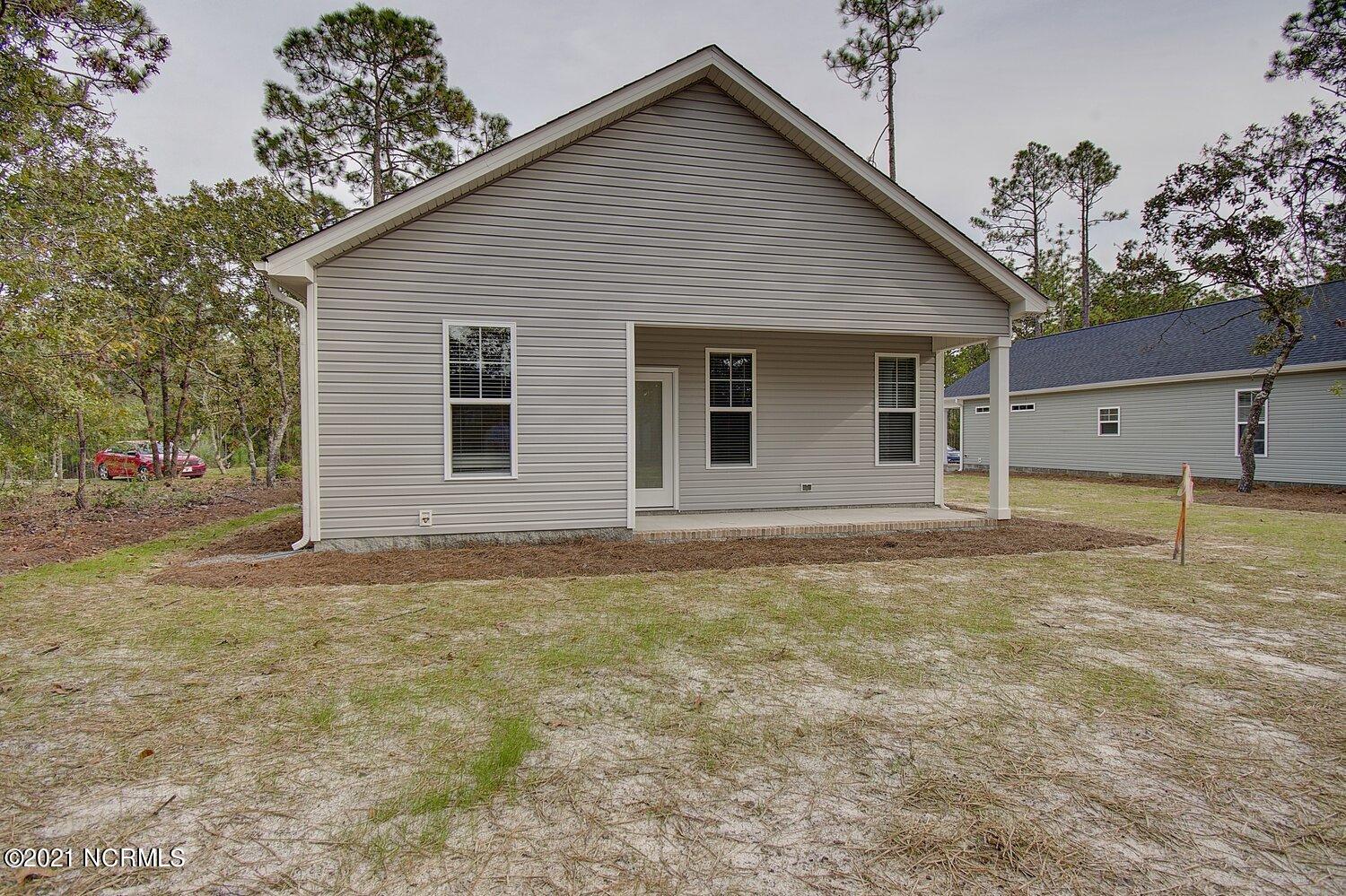 245 Sycamore Road Southport, NC 28461 - Photo 3 of 38 Previously Built Home Picture is a representation of what is to be built. Colors and finishes will vary and are subject to change.