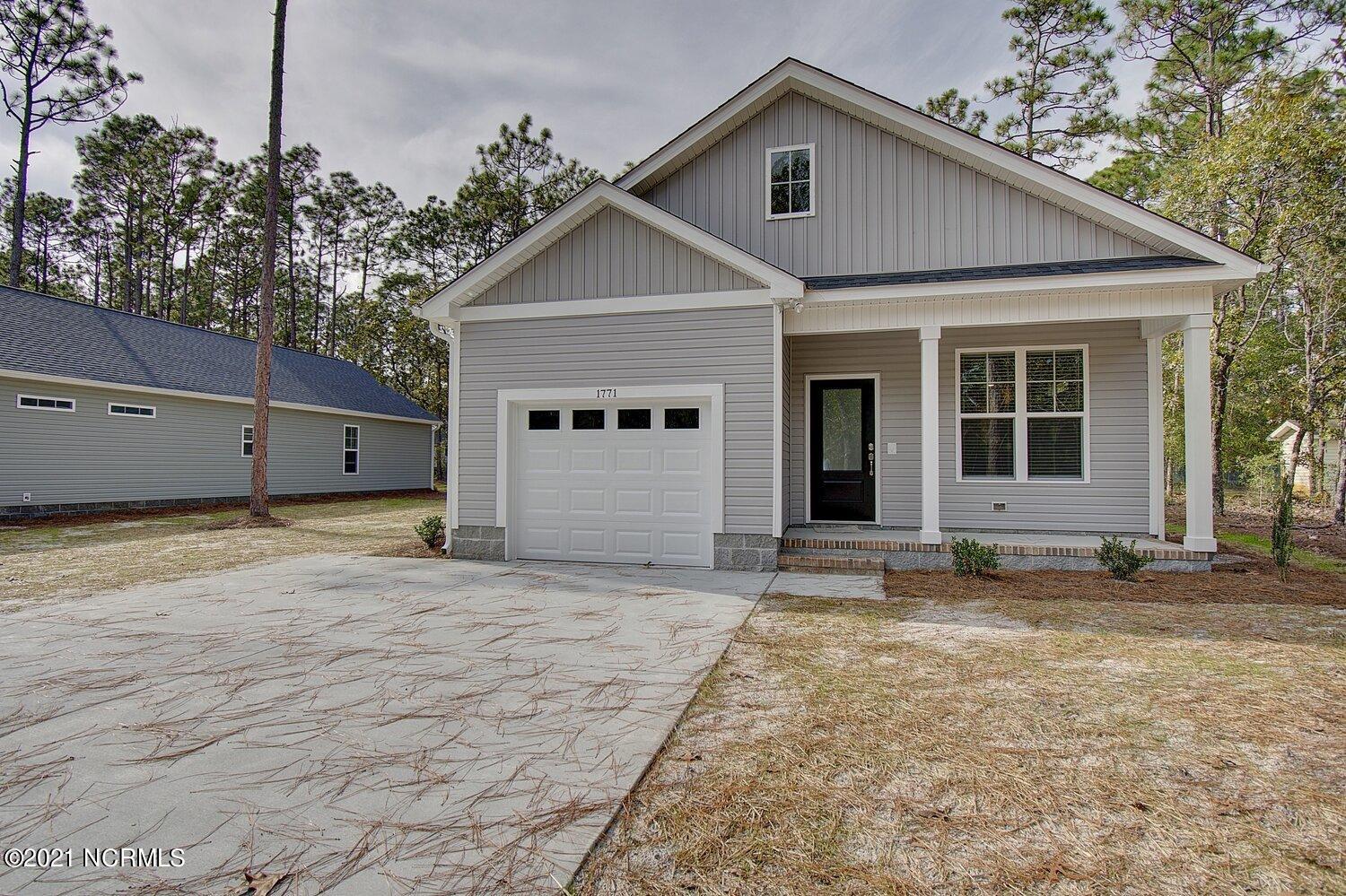 245 Sycamore Road Southport, NC 28461 - Photo 4 of 38 Previously Built Home Picture is a representation of what is to be built. Colors and finishes will vary and are subject to change.