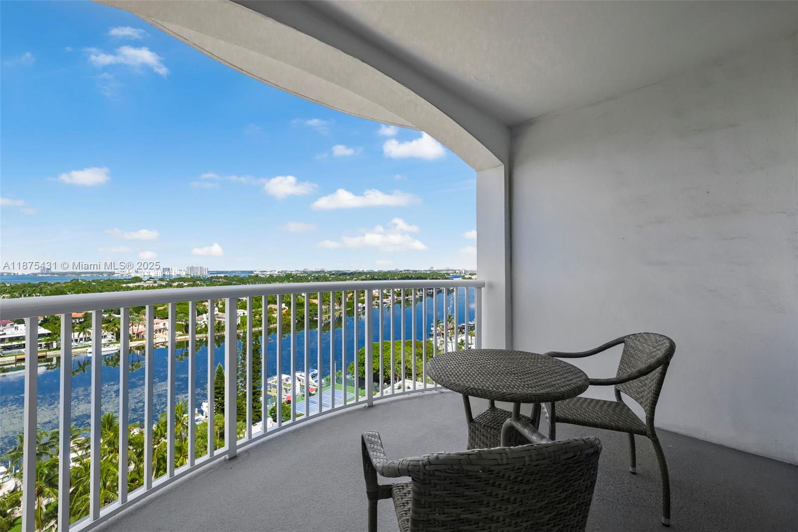 5401 Collins Avenue, Unit 1231 Miami Beach, FL 33140 - Photo 15 of 43 a view of a balcony with chairs