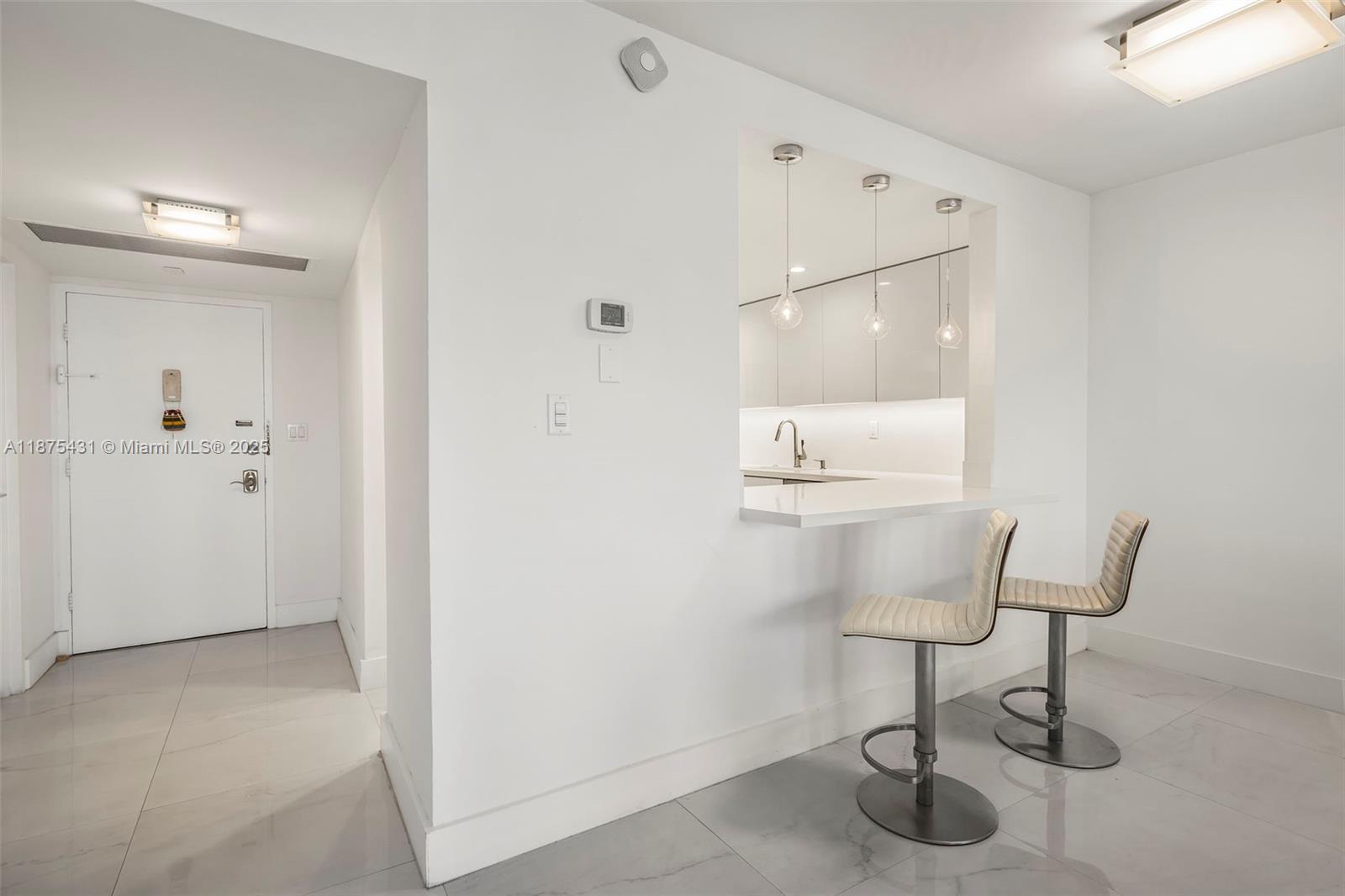 5401 Collins Avenue, Unit 1231 Miami Beach, FL 33140 - Photo 21 of 43 a bathroom with a sink and a mirror