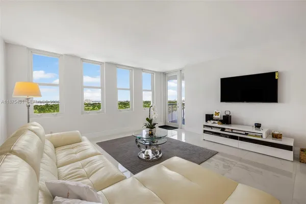 a living room with furniture and a table