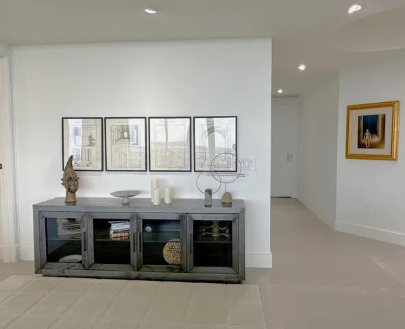 a view of hall way with furniture