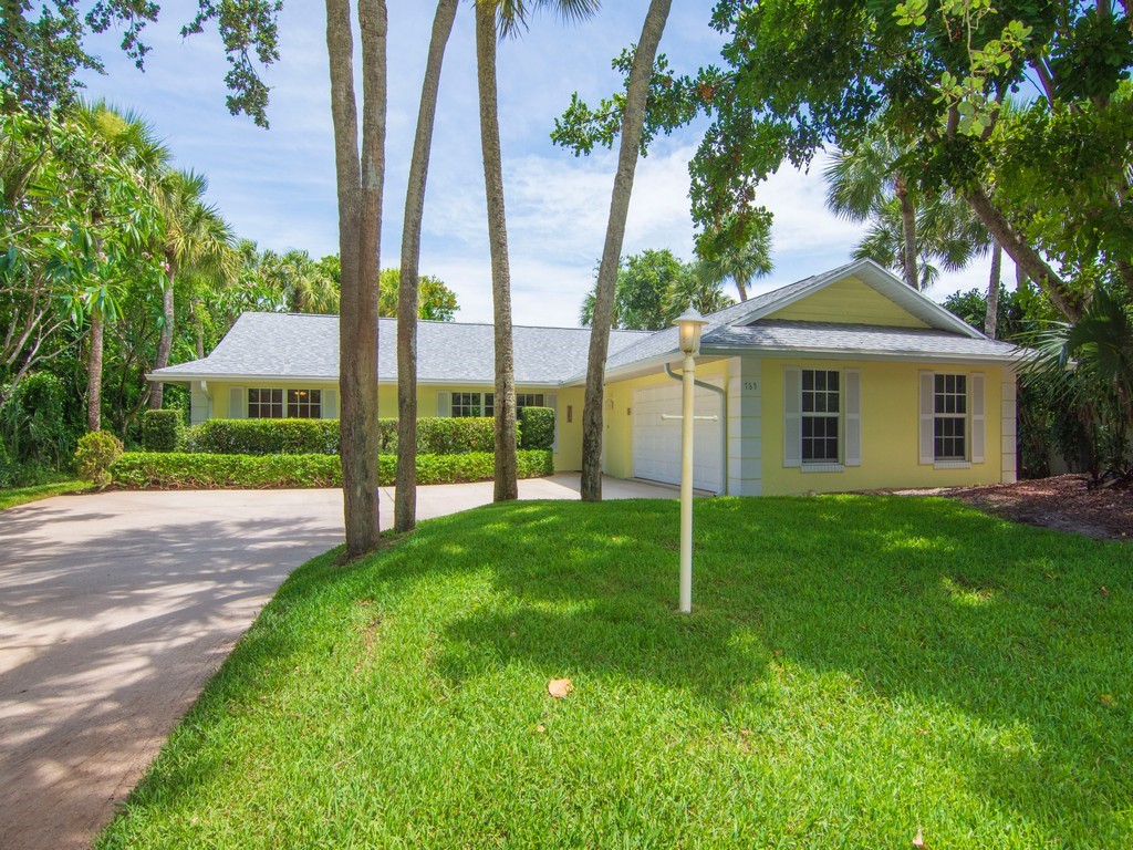 765 Date Palm Road Vero Beach, FL 32963 - Photo 32 of 36 a view of a house with a yard and palm trees